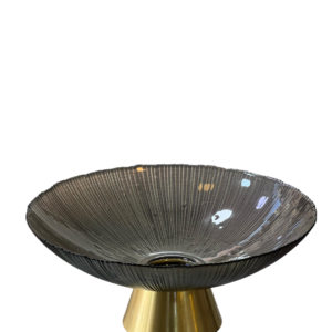 A plate of fruit with a golden base