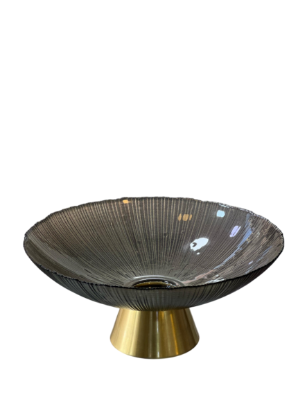 A plate of fruit with a golden base