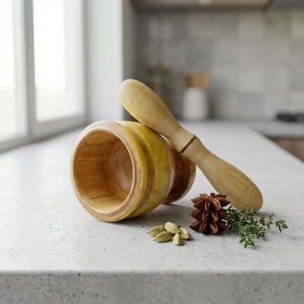 A natural wooden hand-operated mortar and pestle for pounding and grinding garlic, spices, and seasonings.