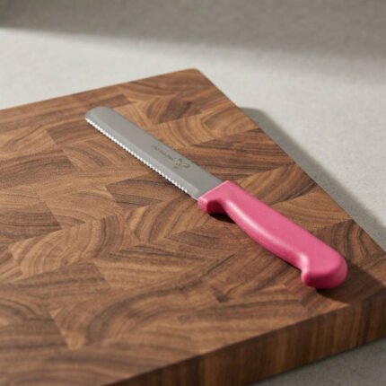 Stainless steel serrated kitchen knife for cutting pastries and cheese with a pink handle, size 6