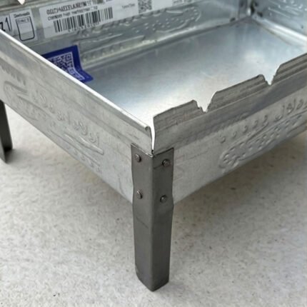 Small, portable rectangular aluminum charcoal grill for trips and camping