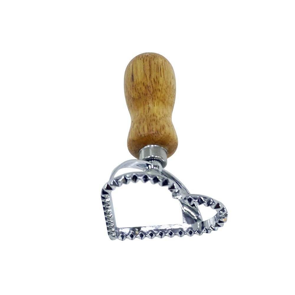 Stainless steel pastry and bread cutter and press in a heart shape with a wooden handle