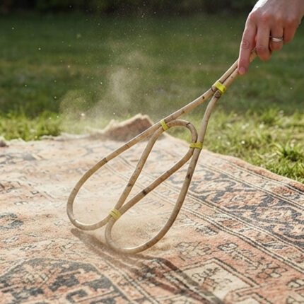 Manual carpet duster made of natural bamboo for cleaning and dusting furniture