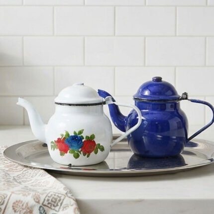 A metal teapot with a lid, coated metal frame, for hot drinks.