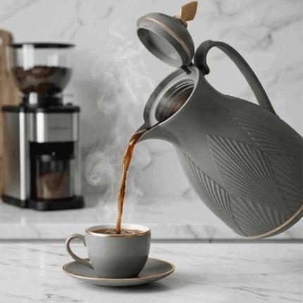 A luxurious thermal thermos for storing tea and coffee, featuring a leaf design and gold accents.