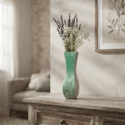 Ceramic tiles featuring a modern green design with a raised and engraved pattern of roses and flowers.